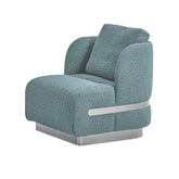 Sven Armchair upholstered in premium powder blue teddy fabric with stainless steel base, ergonomic design, and solid timber frame for modern luxury living room comfort.